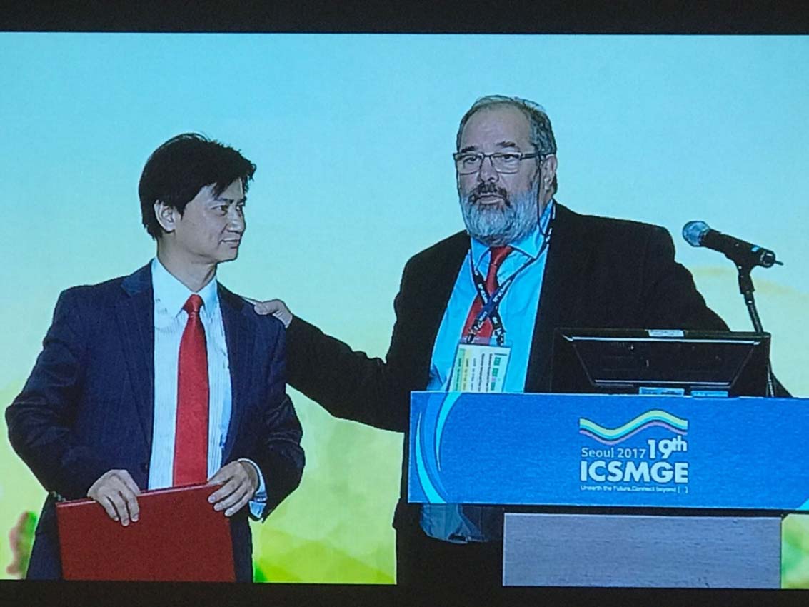 Outgoing President Roger Frank and incoming President Charles Ng at the 19ICSMGE